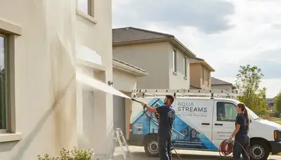 Professional pressure washing in Louisville KY restoring home siding and driveway surfaces